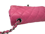 将图片加载到图库查看器，Pink quilted handbag with a silver chain strap on a white background
