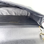 将图片加载到图库查看器，Close-up of a gray leather handbag with gold hardware, featuring the brand name &#39;Chanel&#39;.
