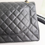 将图片加载到图库查看器，Black quilted handbag with gold hardware on a white background
