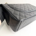 将图片加载到图库查看器，Black quilted handbag on a white background
