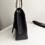 将图片加载到图库查看器，Black leather handbag with chain strap on a white surface
