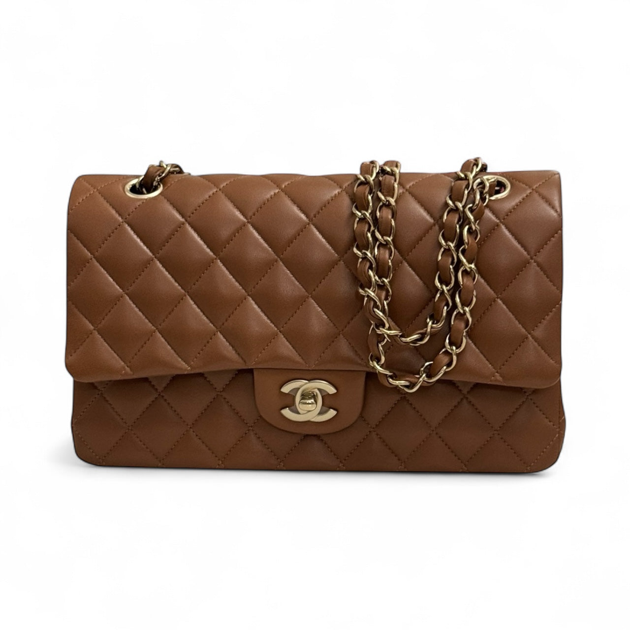 Brown quilted handbag with gold chain and clasp on a white background