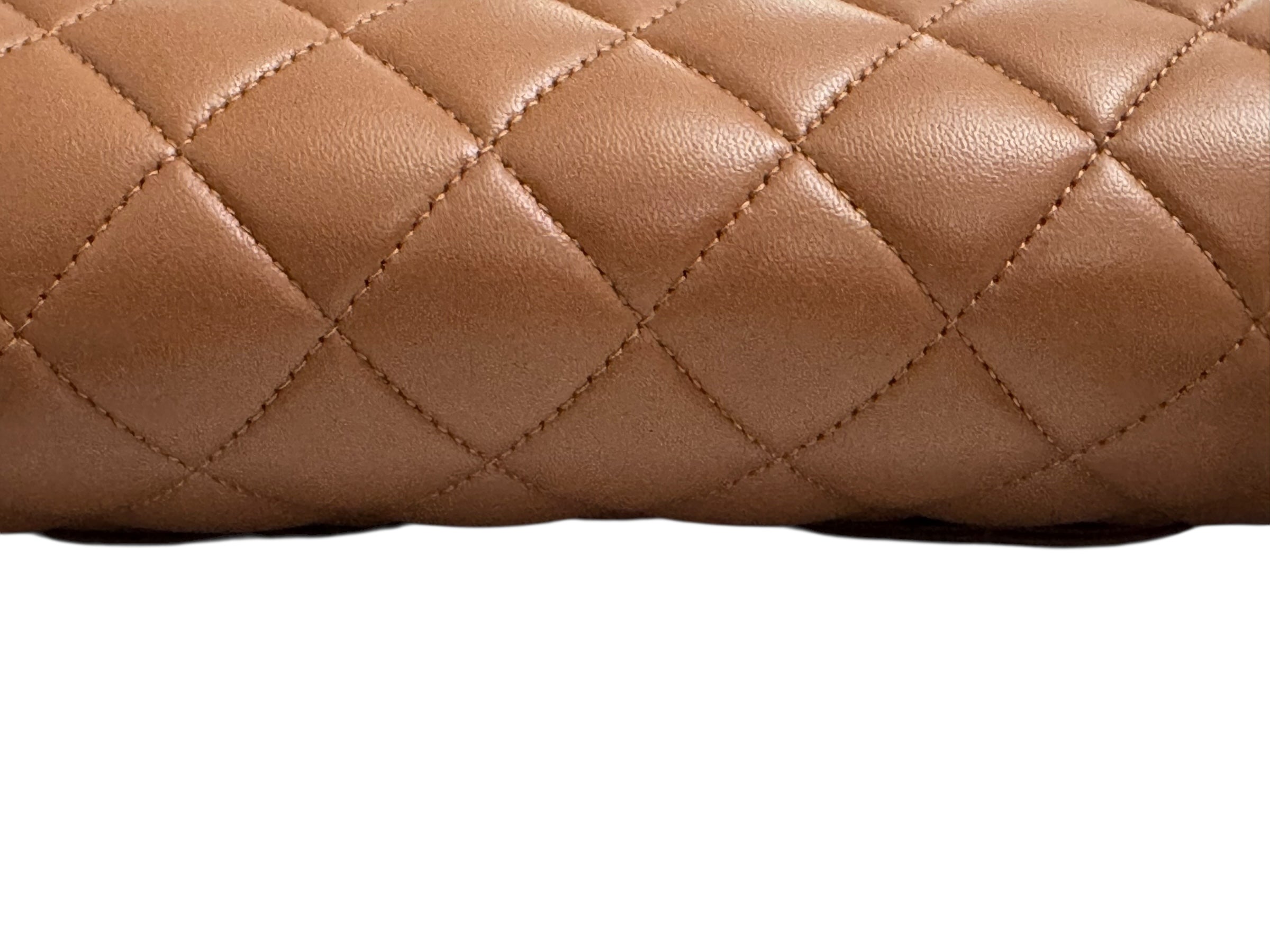Close-up of a brown quilted leather surface