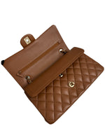 将图片加载到图库查看器，Brown quilted handbag with gold hardware on a white background
