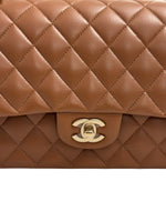 将图片加载到图库查看器，Brown quilted handbag with gold CC logo on a white background
