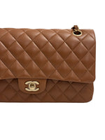 将图片加载到图库查看器，Brown quilted handbag with gold hardware on a white background
