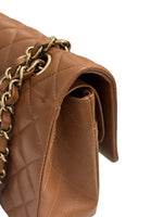 将图片加载到图库查看器，Brown quilted handbag with gold chain detail on a white background
