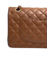将图片加载到图库查看器，Brown quilted handbag on a white background
