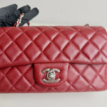 将图片加载到图库查看器，Red quilted handbag with Chanel logo on a light gray background
