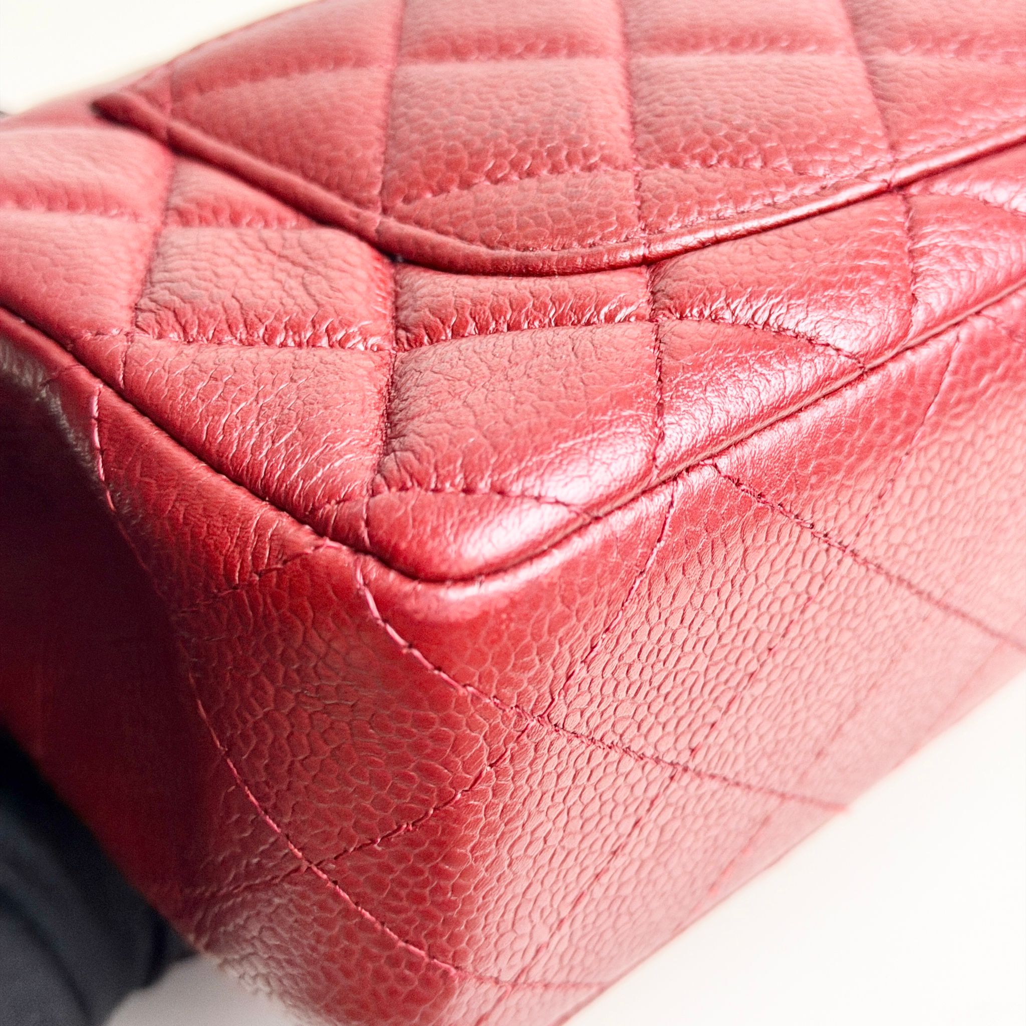 Close-up of a red quilted leather handbag
