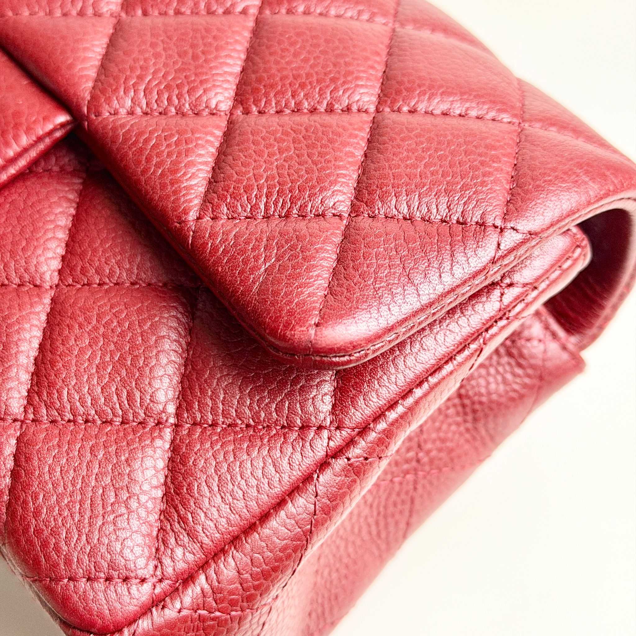 Close-up of a red quilted leather handbag