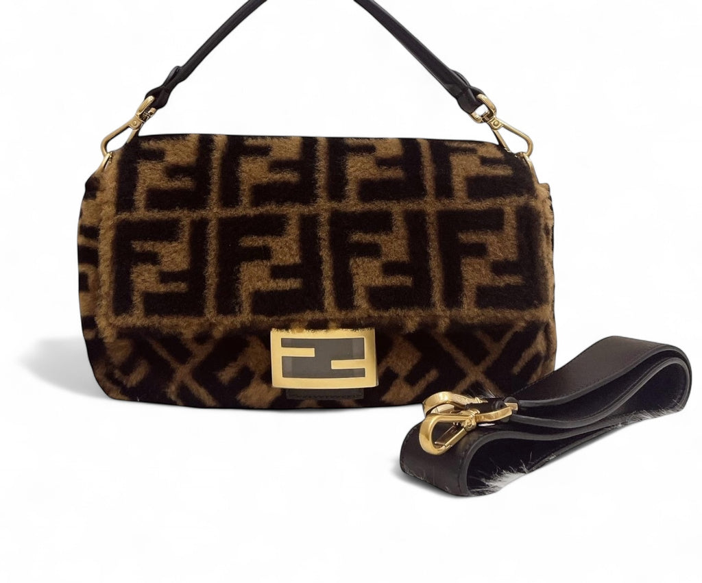 Designer handbag with distinctive pattern and gold clasp on a white background
