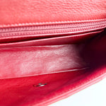 Load image into Gallery viewer, Close-up of a red leather handbag with a zipper.
