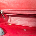 Load image into Gallery viewer, Close-up of a red leather handbag with a zipper
