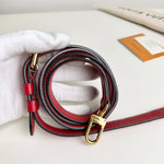 Load image into Gallery viewer, Red and black leather dog leash with gold hardware on a white surface
