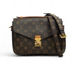 Load image into Gallery viewer, Designer handbag with monogram pattern on a white background
