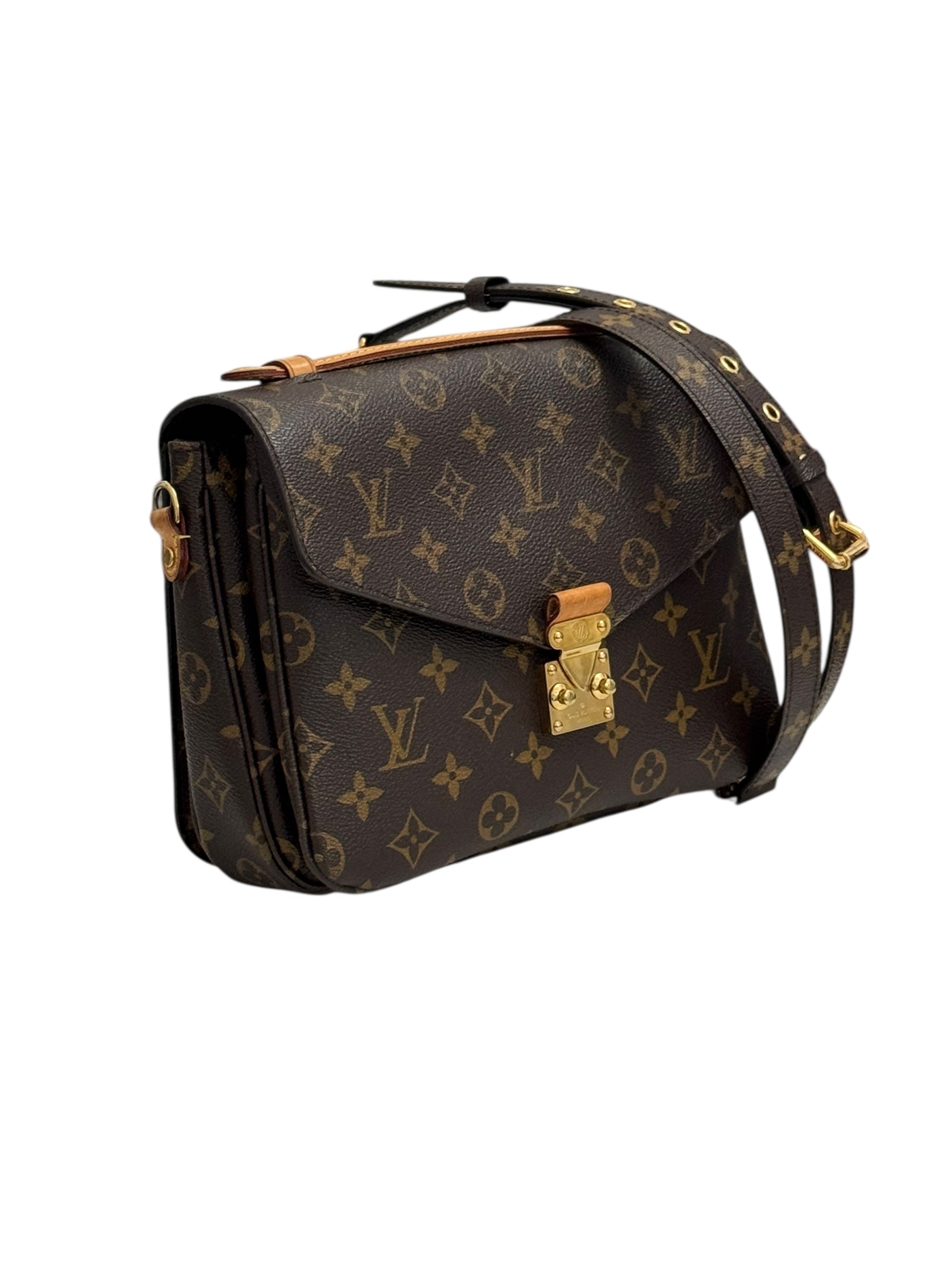 Designer handbag with monogram pattern on a white background