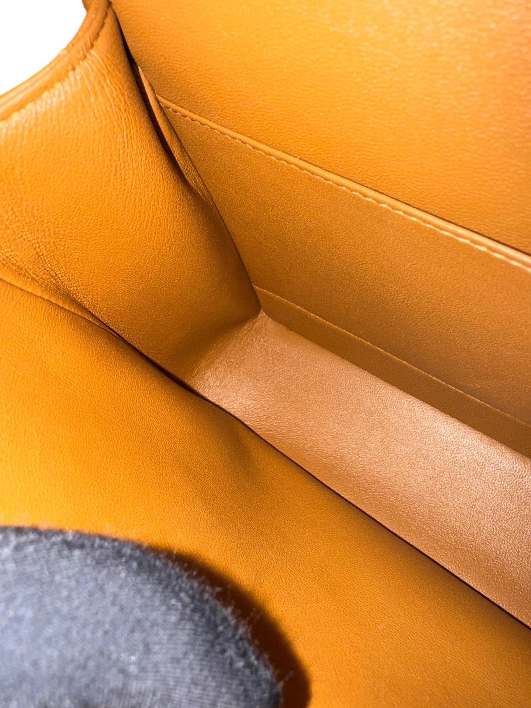 Close-up of a mustard yellow leather seat